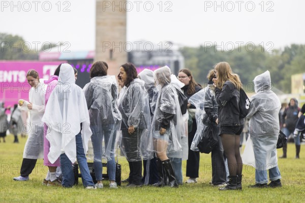 Festivalgoers with rain capes at the Lollapalooza Festival in the Olympiastadion and on the Maifeld, Berlin, 12 July 2025