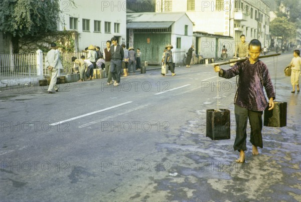 Boat dwellers fetching water during water rationing, Aberdeen, Hong Kong, Asia 1964