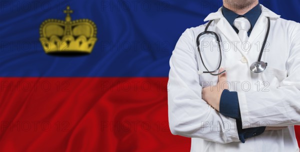 Male doctor with stethoscope on Liechtenstein flag. Doctor holding stethoscope on Liechtenstein flag