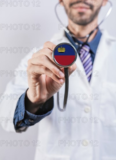 Liechtenstein health and medical insurance concept. Liechtenstein healthcare system, doctor holding stethoscope