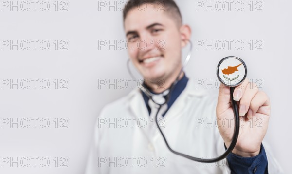 Doctor showing stethoscope with Chipre flag. Chipre national healthcare concept