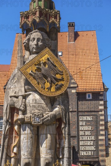 Roland statue on the market square in front of the German House, symbol of medieval urban market law, shield with imperial eagle of the Holy Roman Empire, sword, Old Town, Hanseatic City of Bremen, Germany