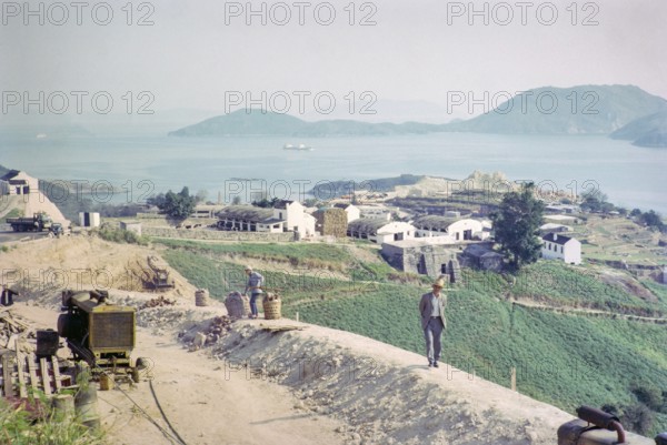 Captioned as 'Dairy land and road widening', Pok Fu Lam, Hong Kong, Asia 1964