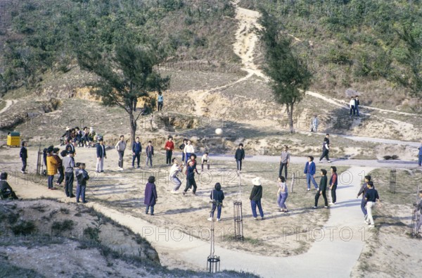 Sunday fun people playing ball game at the Peak, Hong Kong, Asia, 1964
