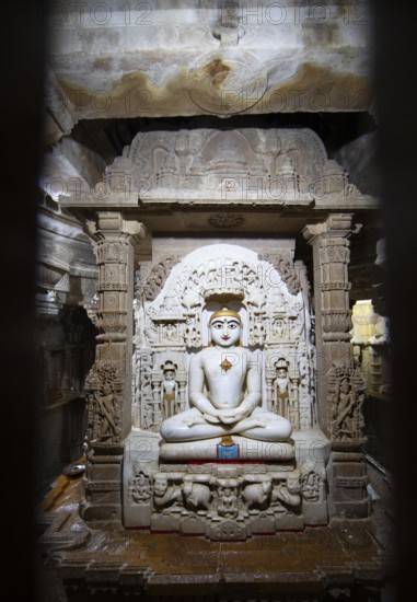 White marble statue of Mahavira in the Jain temple Chandraprabhu in the fortress in Jaisalmer, Rajasthan, India