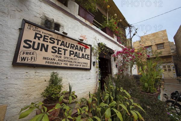 Signpost to the restaurant in the old town of Jaisalmer, Rajasthan, India