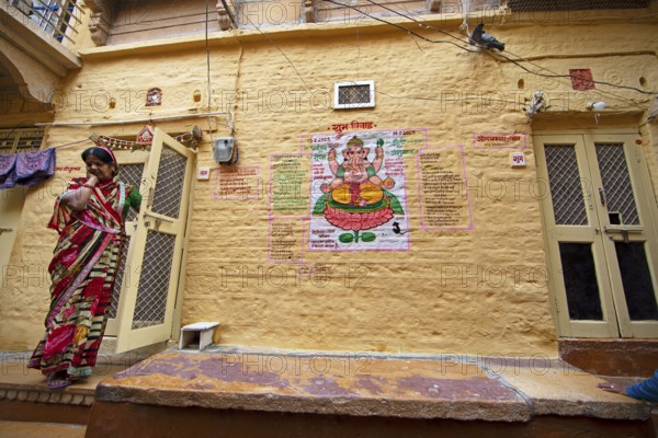 Colourful Ganesha picture on a house wall in the fortress of Jaisalmer, Rajasthan, India