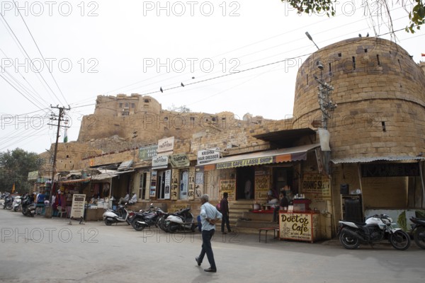 Street scene in the old town of Jaisalmer, the fortress in the background, Rajasthan, India