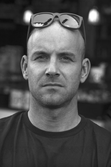 Young man with sunglasses on his head, black and white, Freiburg, Baden-Württemberg, Germany