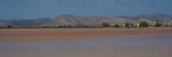 Vast landscape with mountains and huts by the lake, clear sky offered, salt lake, Tigaki, nature reserve, hydro biotope, Kos, Dodecanese, Greek Islands, Greece
