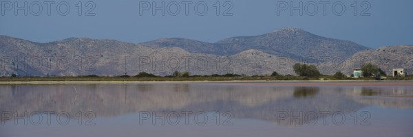 Clear mountains with a calm lake in the foreground, soft reflections and blue sky, salt lake, Tigaki, nature reserve, hydro biotope, Kos, Dodecanese, Greek Islands, Greece