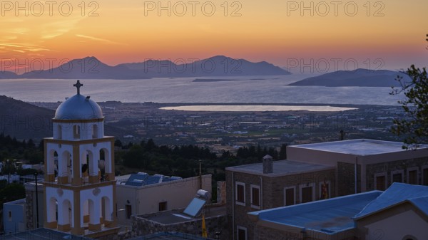 A church at sunset with a view of the sea and the islands, salt lake, Tigaki, nature reserve, hydro biotope, Kos, Dodecanese, Greek islands, Greece