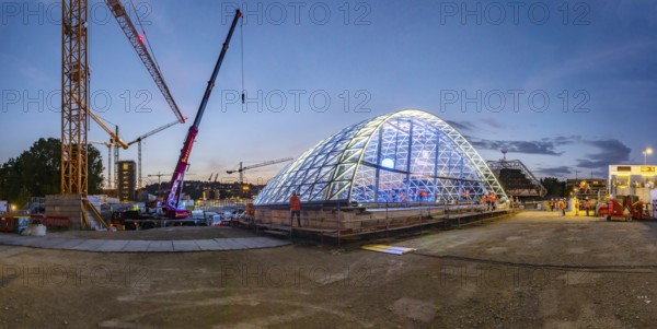 First entrance portal at the new Stuttgart main station completed. One of four so-called lattice shells, which travellers will use to access the underground through station in future, is revealed for the first time. The spectacular steel and glass construction was realised by façade specialist Seele and planned by christoph ingenhoven architects. Stuttgart, Baden-Württemberg, Germany