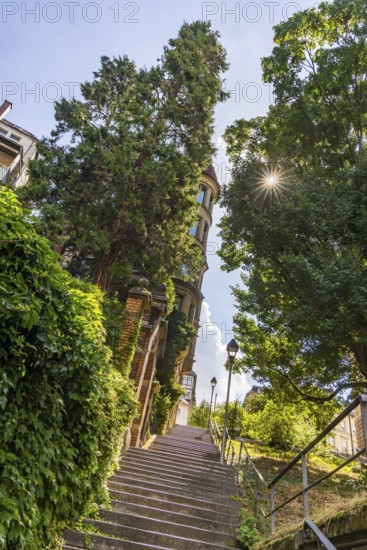 Singing relay at the Schützenplatz in Stuttgart. It is estimated that there are up to 400 Stäffele in Stuttgart. The steps are a shortcut between the half-heights and the city centre. They are also popular as a lookout point or meeting place. The Stäffele are considered one of the landmarks of the state capital. Stuttgart, Baden-Württemberg, Germany