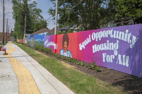Detroit, Michigan - The city of Detroit is opening nine 'Arts Alleys' in neighborhoods around the city. The Yellow Brick Road Arts Alley provides a space for children to ride their bikes and learn about African-American history. Erma Henderson (fence image) was the first African-American elected to the Detroit City Council