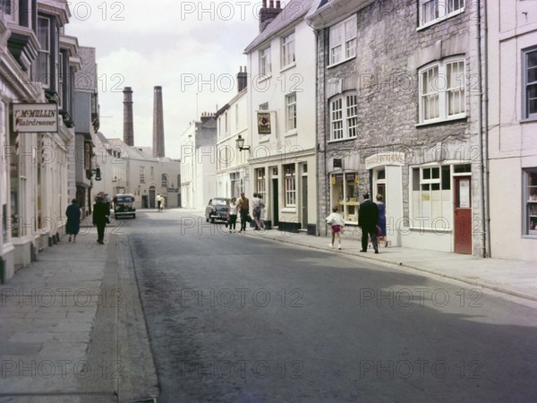Historic Southside Street, Maritime Inn pub view to chimneys of gin distillery, Barbican, Plymouth, Devon, England, UK, c 1960