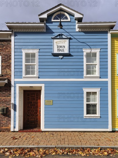 Replica, historic city hall, blue facade, sign with inscription, fall leaves, boutique hotel, theme hotel Adventure Suites Hotel, North Conway, Kancamagus Highway, White Mountain, New Hampshire, New England, USA