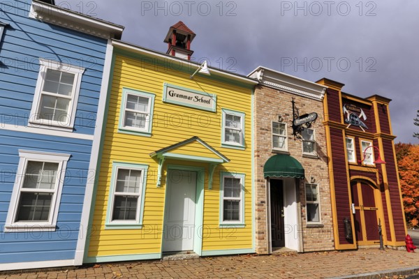Replica, historic elementary school, colorful facades, signs with inscription, boutique hotel, theme hotel Adventure Suites Hotel, North Conway, Kancamagus Highway, White Mountain, New Hampshire, New England, USA