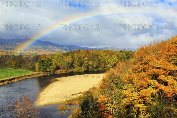 Scenic river landscape with rainbow, Saco River in Mount Washington Valley, colorful fall leaves, Indian summer, sunny weather, Conway, Kancamagus Highway, White Mountain, New Hampshire, New England, USA