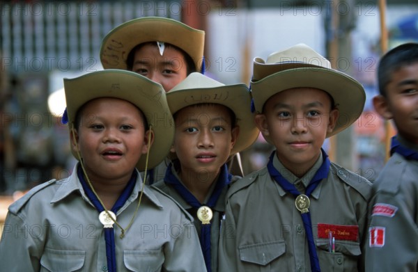 Young scouts at Damnoen Saduak floating market, Thailand, December 2002, vintage, retro, old, historic