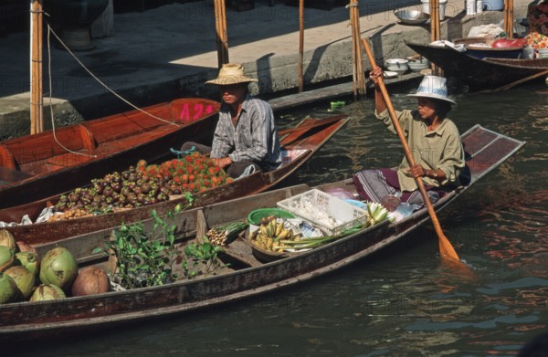 Merchants in their boats at Damnoen Saduak Floating Market, Thailand, December 2002, vintage, retro, old, historic