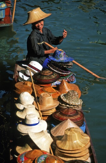 Hat seller in her boat at Damnoen Saduak Floating Market, Thailand, December 2002, vintage, retro, old, historic