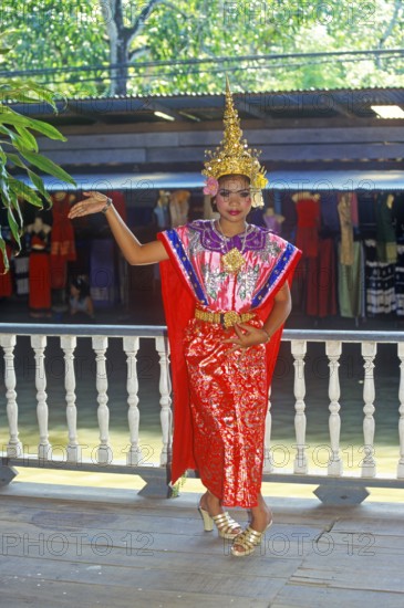 Young person wearing Thai drama clothes at Damnoen Saduak Floating Market, Thailand, December 2002, vintage, retro, old, historic