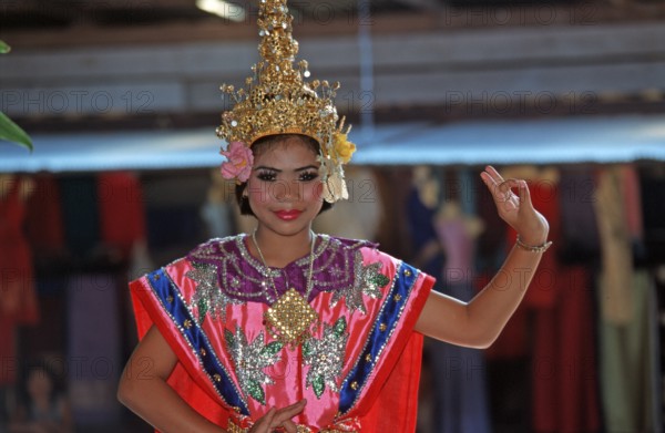 Young person wearing Thai drama clothes at Damnoen Saduak Floating Market, Thailand, December 2002, vintage, retro, old, historic