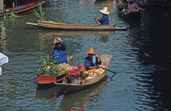 Merchants in their boats at Damnoen Saduak Floating Market, Thailand, December 2002, vintage, retro, old, historic