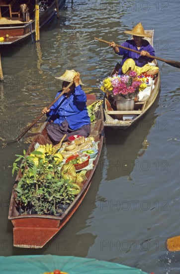 Merchants in their boats at Damnoen Saduak Floating Market, Thailand, December 2002, vintage, retro, old, historic