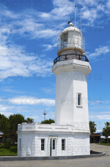 White lighthouse against a blue sky with some clouds and palm trees in the background, lighthouse, Batumi, Black Sea, Ajara region, Adjara, autonomous republic, Georgia