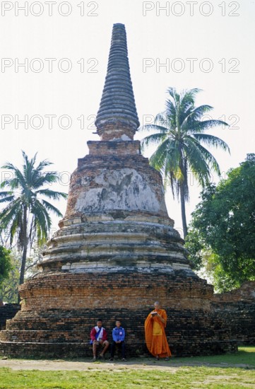 People, monk, boys, palm trees, chedi at Wat Phra Si Sanphet, Ayutthaya, Thailand, December 2002, vintage, retro, old, historical