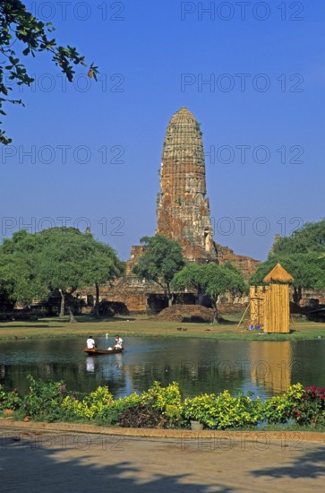 Pond, boat, people, temple ruin in Ayutthaya, Thailand, December 2002, vintage, retro, old, historic