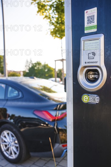 Electric car at a charging station, modern design with QR code and environmentally friendly symbols, BMW i7 electric car, deer e-car sharing, Calw, Germany