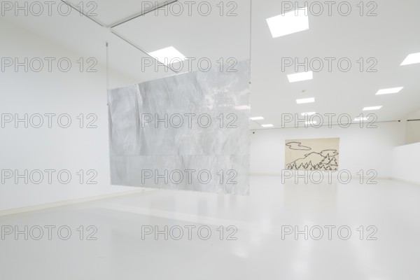 A metal work of art hangs in a minimalistic exhibition space, Schauwerk, Sindelfingen, Germany