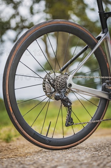 Side view of a bicycle rear wheel with technology and tires present, Triathlon, Calw, Germany
