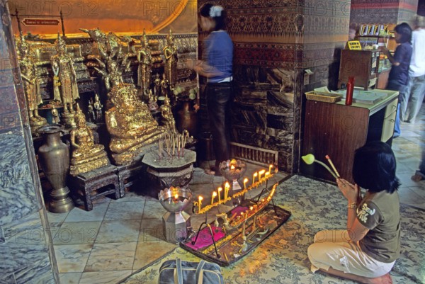 Believers praying, Wat Pho, Bangkok, Thailand, December 2002, vintage, retro, old, historic