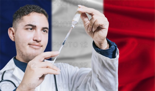 Doctor holding syringe on France flag background. Medical professional holding syringe with French flag in the background