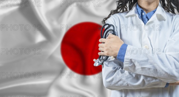 Healthcare professional with Japan flag background. Professional doctor holding stethoscope on Japan flag background