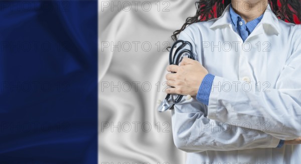 Healthcare professional with France flag background. Professional doctor holding stethoscope on France flag background
