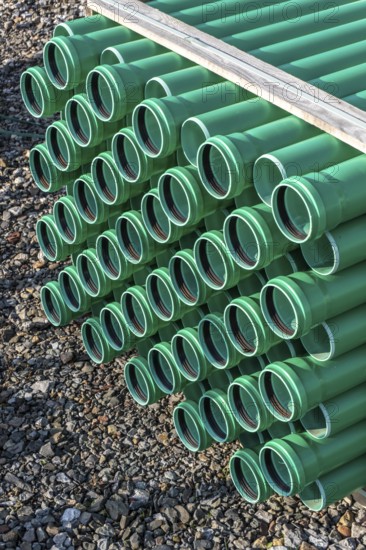 Symbolic picture construction site, sewage pipes for dirty and rainwater, for installation in the ground, plastic pipes, made of polypropylene, storage on a construction site