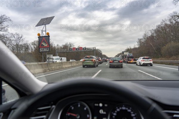Traffic jam on the A3 motorway, direction Oberhausen, near Ratingen, solar-powered information board announces the traffic jam due to construction work