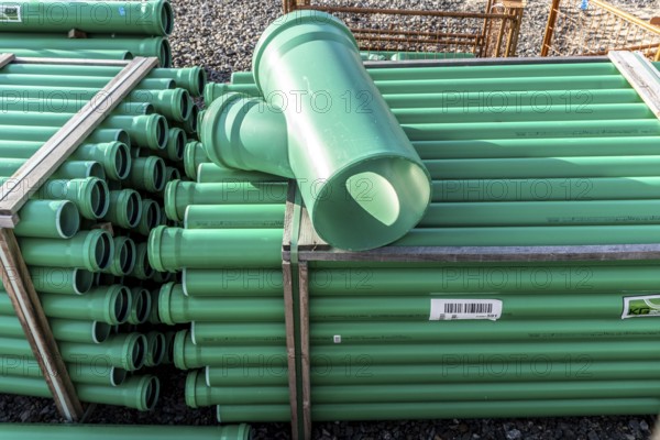 Symbolic picture construction site, sewage pipes for dirty and rainwater, for installation in the ground, plastic pipes, made of polypropylene, storage on a construction site