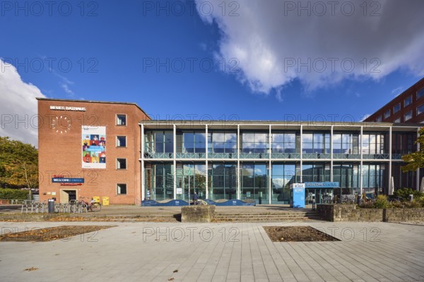 New town hall, tourist information, welcome center, brick building, modern architecture, glass façade, staircase, concrete paving stone walkway, trees, blue sky, cumulus clouds, stratocumulus clouds, Stresemannplatz, Andreas-Gayk-Straße, Kiel, state capital, district-free city, Schleswig-Holstein, Germany