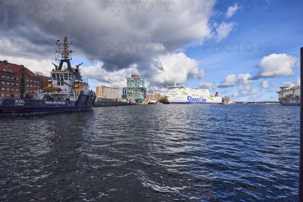 Kiel Fjord, port, wharf, ferry Stena Germanica, Stena Line GmbH, port tug and sea tug Kiel, tow and ferry company Kiel mbH, general architecture, lake port Kiel GmbH and Co. KG, blue sky, cumulus clouds, white and dark clouds, Kiel, state capital, district-free city, Schleswig-Holstein, Germany