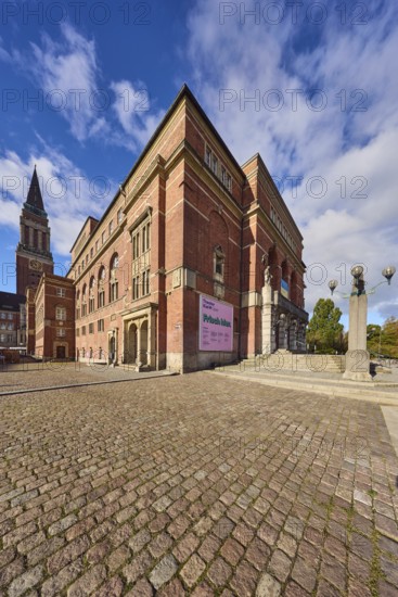 Opera house, architect Christian Heinrich Seeling, art nouveau style, brick building, brick architecture, building material brick and sandstone, staircase, lantern, general development, town hall tower, cobblestone square, trees, blue sky, cumulus clouds, town hall square, Kiel, state capital, district-free city, Schleswig-Holstein, Germany