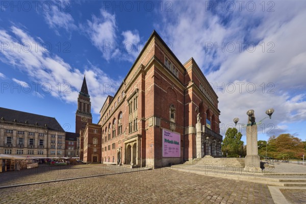 Opera house, architect Christian Heinrich Seeling, art nouveau style, brick building, brick architecture, building material brick and sandstone, staircase, lantern, general development, town hall tower, cobblestone square, trees, blue sky, cumulus clouds, town hall square, Kiel, state capital, district-free city, Schleswig-Holstein, Germany