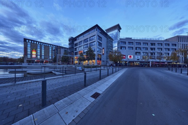 Holstenfleet, water area, commercial building, modern architecture, road, curve, stainless steel railing, barrier bollard, evening blue hour, blue evening sky, cumulus clouds, Berliner Platz, wall, Kiel, state capital, district-free city, Schleswig-Holstein, Germany