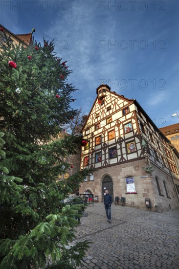Historic Pilate House with the annual advent calendar in the evening light, Tiergärtnertor, Nuremberg, Middle Franconia, Bavaria, Germany