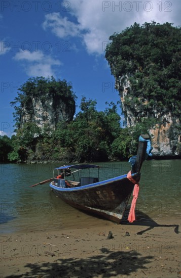 Longtail boat on the banks of the tidal river near Krabbi, two years in front of the tsunami, Thailand, December 2002, vintage, retro, old, historic